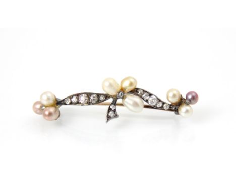 A 19th century diamond and freshwater pearl brooch, the central motif of three pearls designed as stylised clover leaf, with 