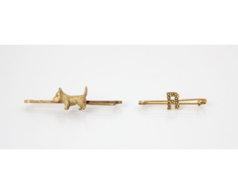 A selection of four yellow metal brooches, including a 9ct yellow gold double heart brooch, stamped 'PPLd', Chester 1899, 5cm
