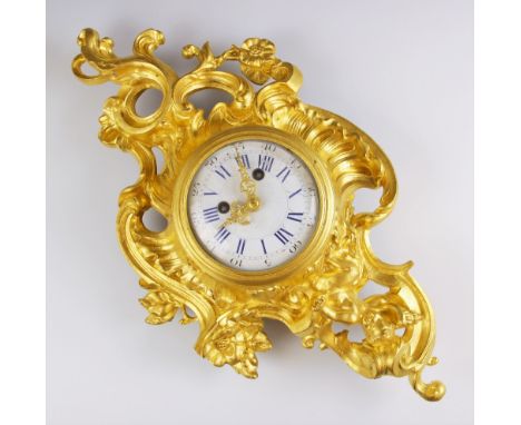 A Louis VXI style wall clock, late 19th century, the rococo style case cast with a cherub figure extending to foliate scrolls