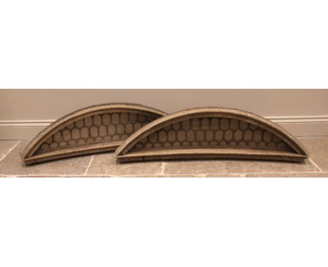 A pair of 19th century gilt wood and gesso architectural transom, each of slightly curved crescent form, with gilt embellishe