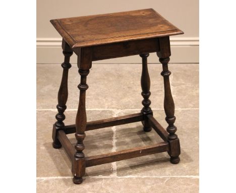An 18th century style jointed oak stool, the rectangular top upon slender baluster, bobbin turned supports and bun feet, unit