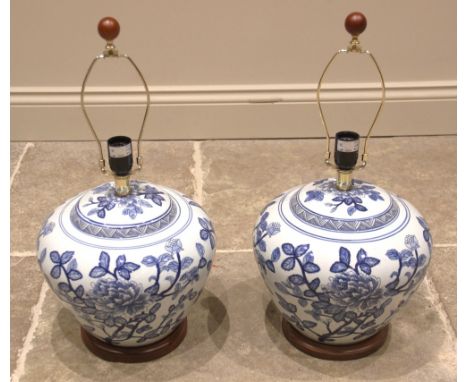 A pair of Ralph Lauren Chinese influence blue and white vase table lamps, of tapering form upon integral hardwood plinths, co