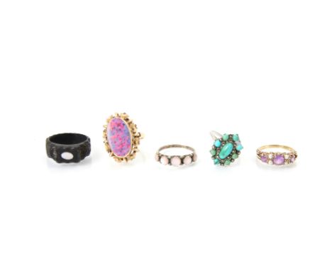 A selection of five dress rings, including a pink stone five stone, a yellow metal ‘opal’ doublet ring with floral detailed b