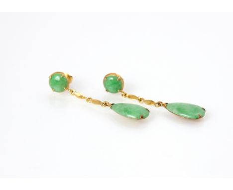 A pair of untested jade earrings, the cabochon cut green stone stud within yellow metal mount, with conforming spacers suspen