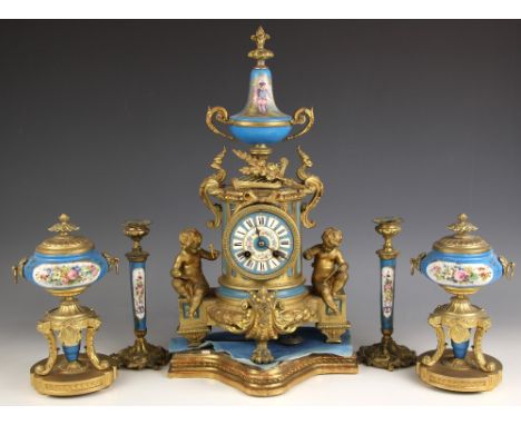 A French Louis XVI style ormolu and Sevres type bleu celeste porcelain inset mantel clock garniture, 19th century, the 10cm p