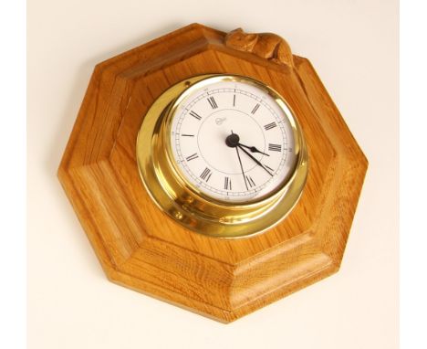 Workshop of Robert "Mouseman" Thompson of Kilburn, a Barigo wall clock set to an oak octagonal mount, trademark carved mouse 