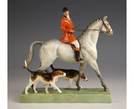 A Royal Worcester 'Huntsman and Hounds', modelled by Doris Lindner, number 3115, date code for 1937, 19.5cm high (at fault) a
