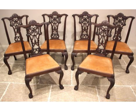 A set of eight mahogany Chippendale style dining chairs, early 20th century, each with a ribbon tied, interlaced splat back, 
