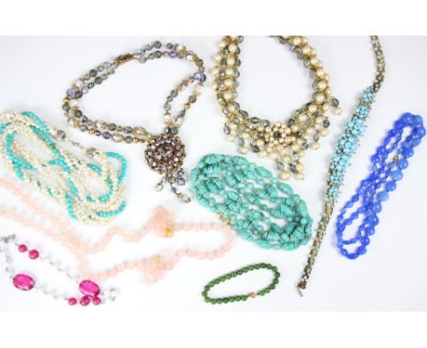A selection of beads, including a string of rose quartz with carved elephant detail, two Victorian style paste chokers suspen