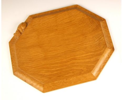 Workshop of Robert "Mouseman" Thompson of Kilburn, a carved oak breadboard, of canted rectangular form, with carved trademark