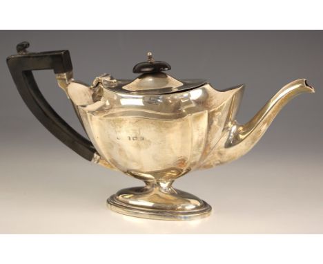 A George V silver teapot, S Blanckensee and Son Ltd, Birmingham 1920, of plain polished and cusped form, raised on an oval pe