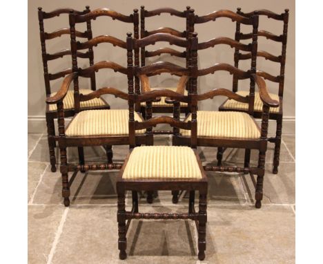 A set of six 18th century style oak ladder back dining chairs, mid 20th century, each with a drop-in seat upon bobbin and blo