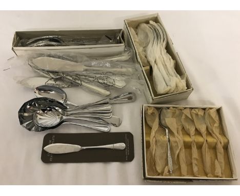 A small quantity of vintage cutlery. To include fish knives and forks, cased teaspoons, dessert serving spoons and small spoo
