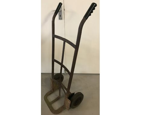 A vintage metal sack barrow with rubber gripped handles.  