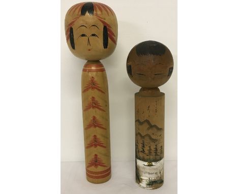 2 vintage wooden Japanese Kokeshi dolls, both with signatures to underside.  Largest approx. 27cm tall.