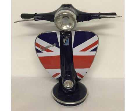 A large table lamp in the shape of the handlebars of a Vespa scooter with Union Jack detail.  Approx. 62cm tall.