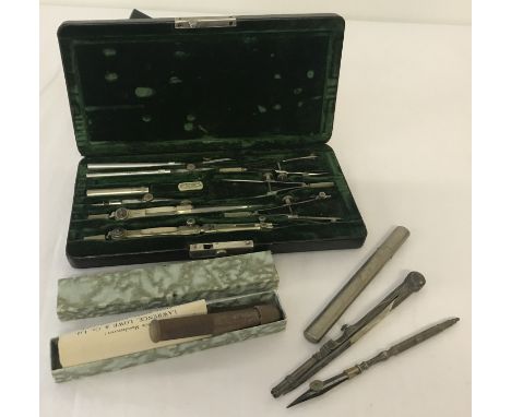 A vintage cased Keuffel &amp; Esser drafting/drawing instrument set together with other items. Boxed set has compartmentalise