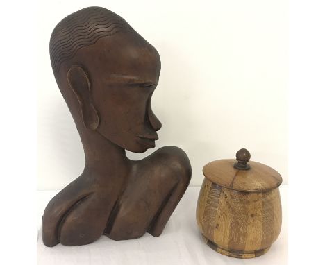 A dark wood tribal carving of a head in profile together with a vintage stoneware lined tea caddy.  Head approx. 34cm tall.