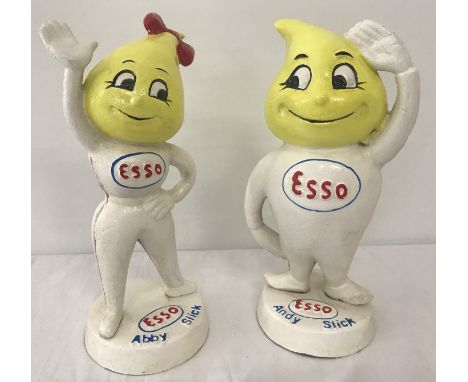 A pair of painted cast metal Esso money boxes in the shape on Andy &amp; Abby Slick.  Approx. 23cm tall.