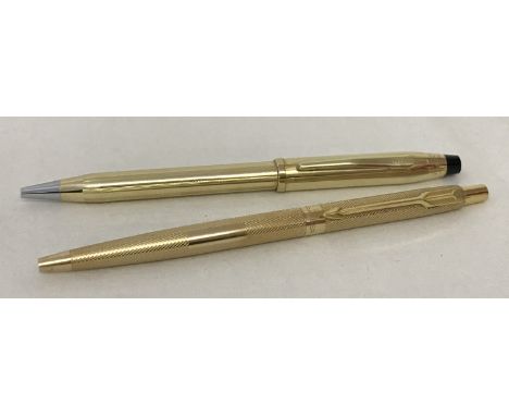 A 10ct rolled gold ball point pen by Cross. Together with a gold tone Parker ball point pen with engine turned detail and emp