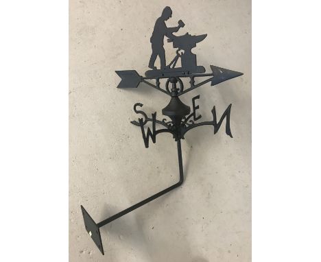 A black cast metal weather vane with blacksmith detail to top. Complete with wall fixing bracket and fixing holes. Approx. 68