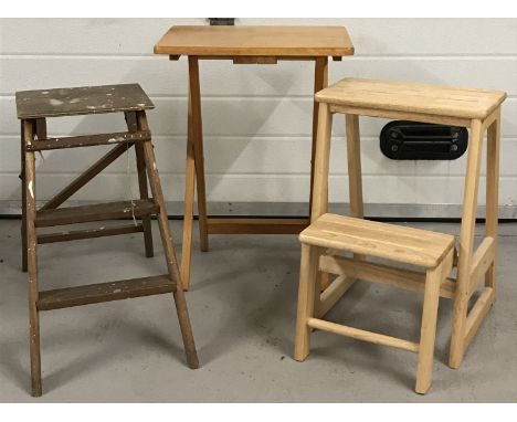 A set of vintage small folding steps. Together with a modern light wood folding TV table and a set of modern pine utility ste