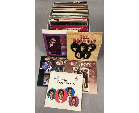A box of mixed vintage LP records. To include: Glen Miller, Herb Alpert, The Hollies, The Monkees and Buddy Holly. 