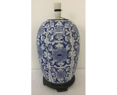 A large blue and white Oriental ceramic pumpkin style lamp base.  Approx. 44cm tall to top of fitting.