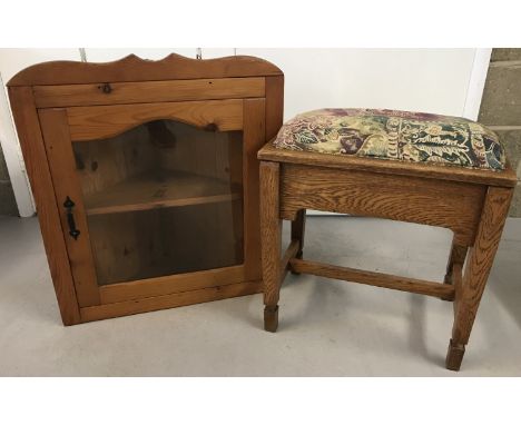 A vintage pine corner wall cupboard with glazed door. Approx. D45 xW70xH73cm.  Together with a solid light oak piano stool wi
