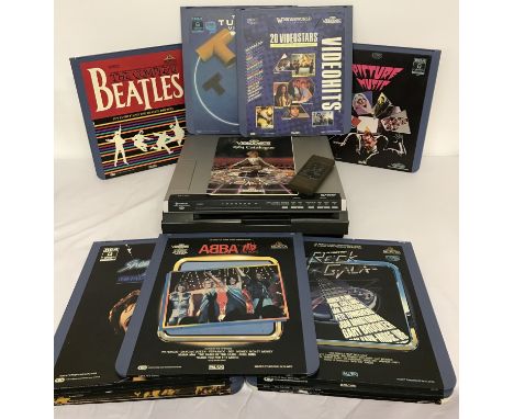 A vintage Hitachi CED Videodisc player together with a collection of 16 x 1980's music videodiscs. Discs to include: The Tube