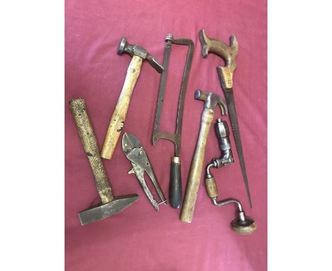 A small collection of antique and vintage tools. Comprising a Tyzack &amp; Sons keyhole saw; an antique hacksaw; a cobbler's 