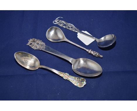 Four decorative silver spoons, one by Levi & Salomon, Birmingham 1906, with Madonna and Child finial; another American stampe