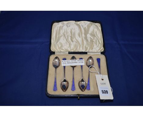 A set of six silver and enamel coffee spoons, Birmingham 1929, in fitted case.