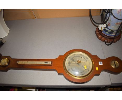A walnut cased Valenti Sherborne barometer.