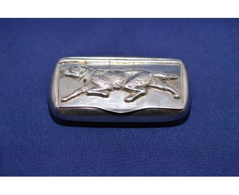 An imported silver snuff box, decorated with a working dog to lid, gilt interior.