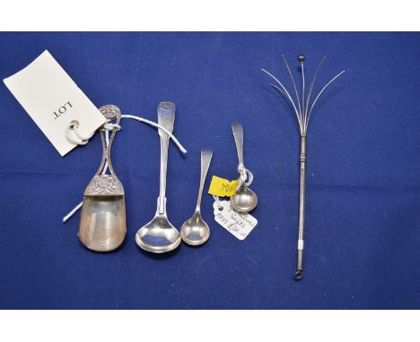 A silver cocktail stick; a silver caddy spoon; and three silver salt spoons.
