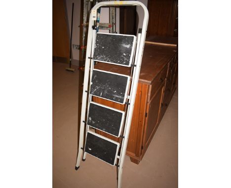 A white painted folding step ladder.
