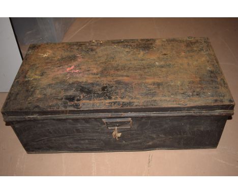 A metal trunk with carrying handles, 36in wide.