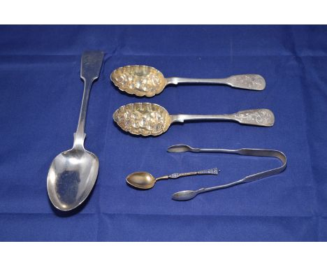 A quantity of spoons, including a gilt and blue enamel spoon; a pair of Victorian Scottish spoons with embossed bowls; a Geor