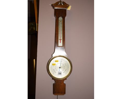 An early 20th Century barometer, by Comitti of London, in rosewood case.