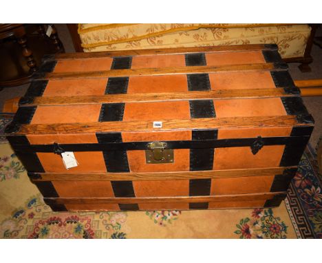 A 20th Century metal, wood and leather bound travelling trunk.