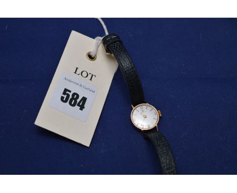 A Tissot 9ct. gold cased lady's cocktail watch, on leather strap.
