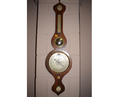 A late Victorian wheel barometer in walnut case.