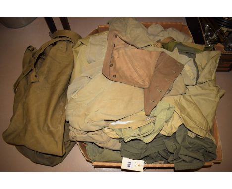 WWII and later khaki military clothing, to include: shirts and trousers, some dated and having broad arrow mark.