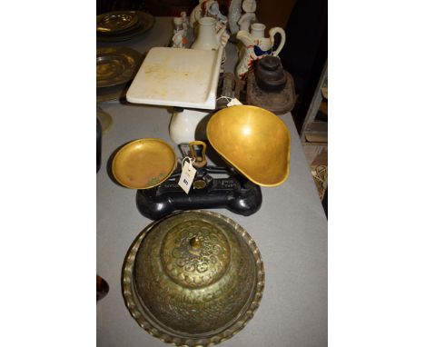 A pair of white painted metal kitchen scales, by W. & T. Avery Ltd; a pair of black painted and brass Libra scales; and a Mid