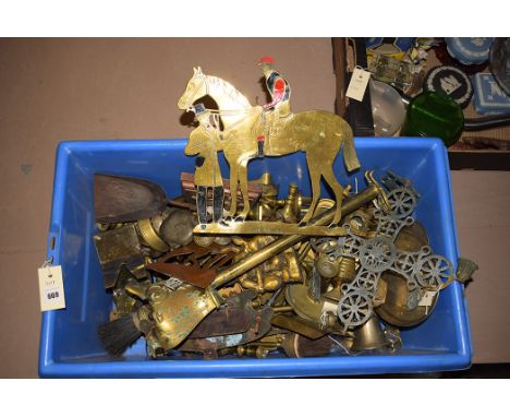 Brassware, to include: candlesticks; brass companion set; a brass and enamel plaque of a jockey, horse and trainer; and other