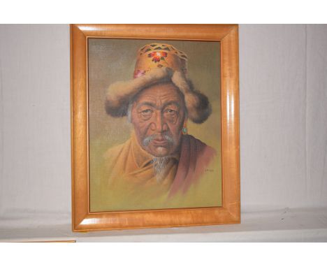 A pastel painting by G. Douglas - portrait of a Tibetan man, signed.