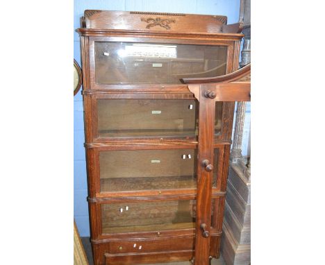 A Globe Wernicke oak four tier stacking bookcase with drawer to base 90cm wide