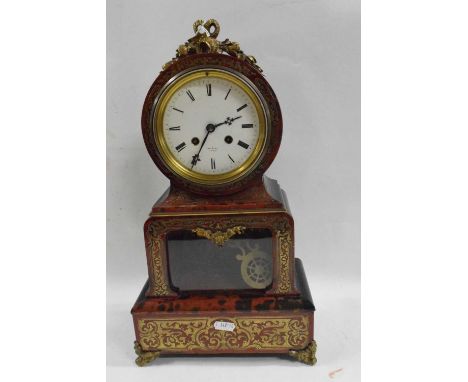 HRY Marc Paris, a simulated boule and ebonised mantel clock of drum head form fitted with a brass movement striking on a bell