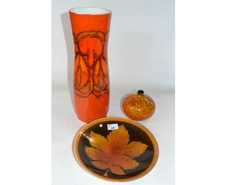 A group of three Poole pottery wares comprising a large red glazed Adelphis type vase, a fern leaf bowl and further vase with
